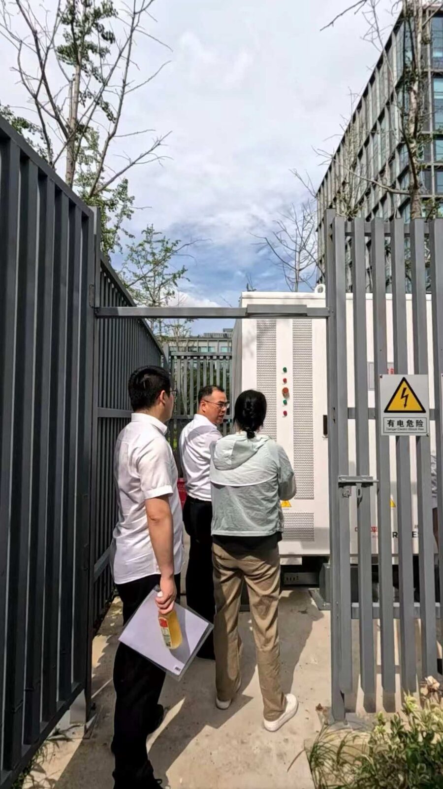 Engineers inspecting the storage system