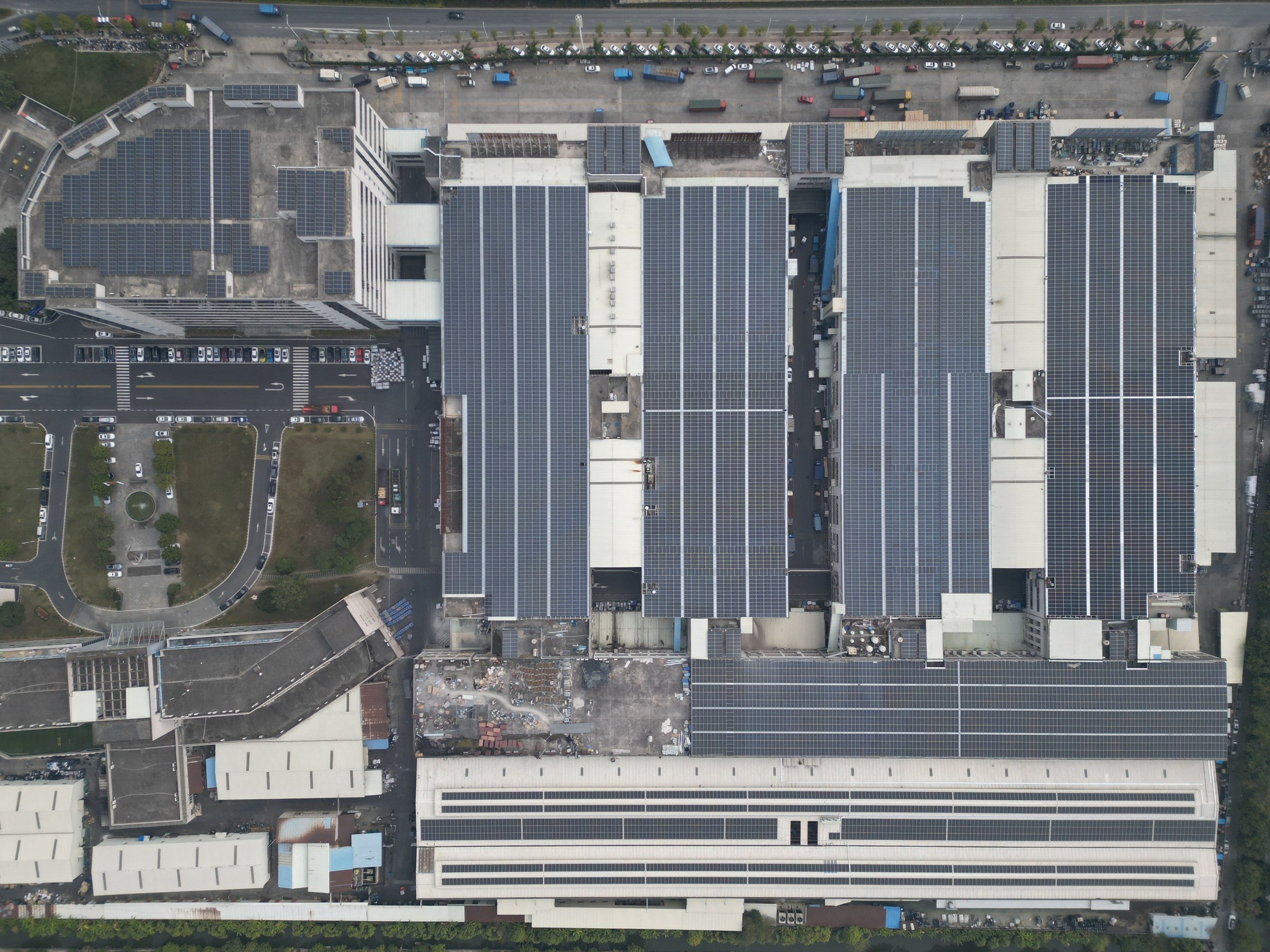 Aerial view of factory rooftops in Zhongshan covered with solar panels